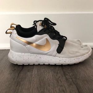 Gold swoosh Nikes